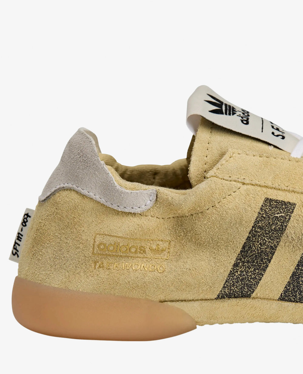 Heel detail of the adidas x Song For The Mute Taekwondo Mei sneaker in cream suede.